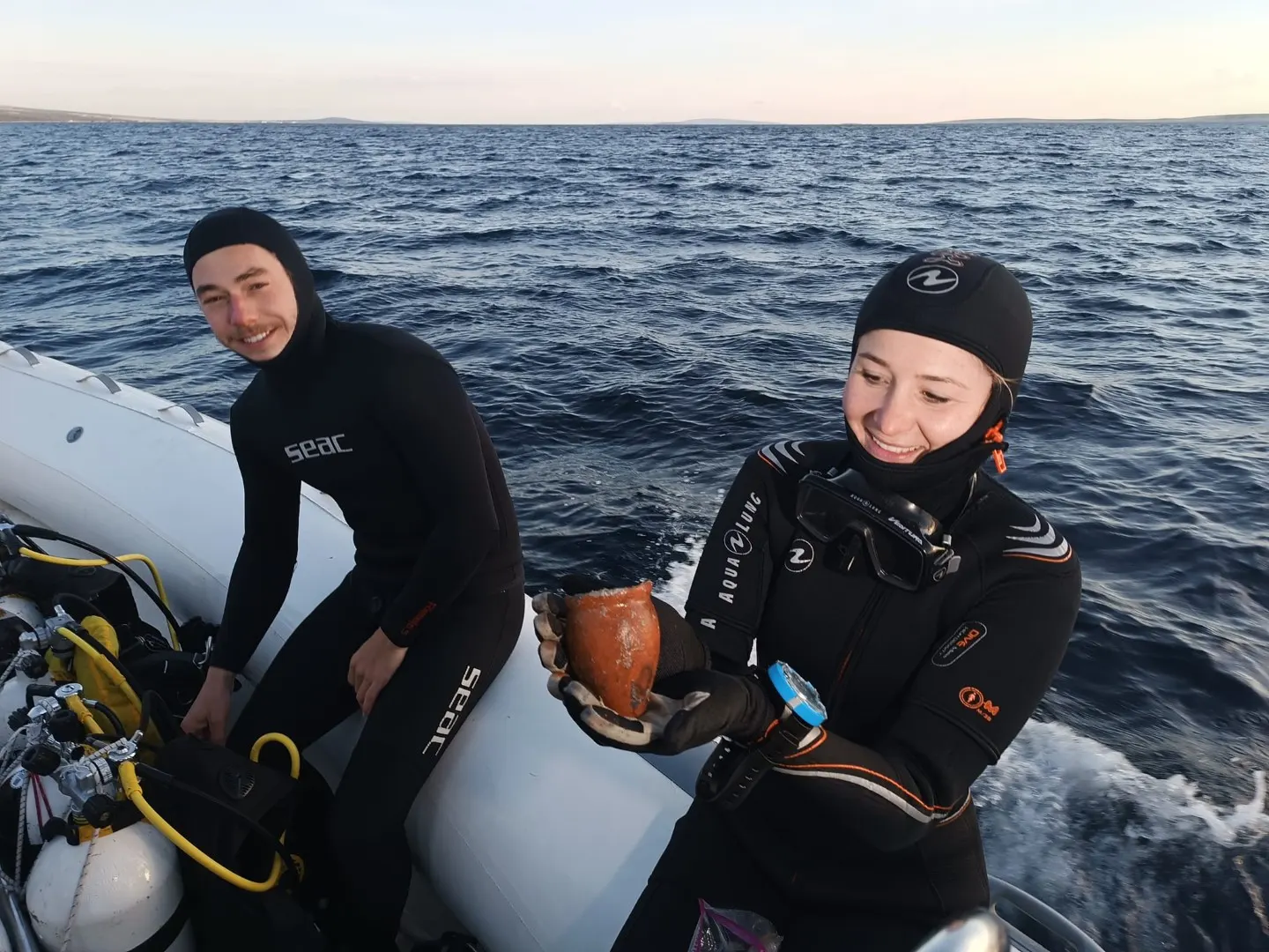 A diver documenting the amphora field